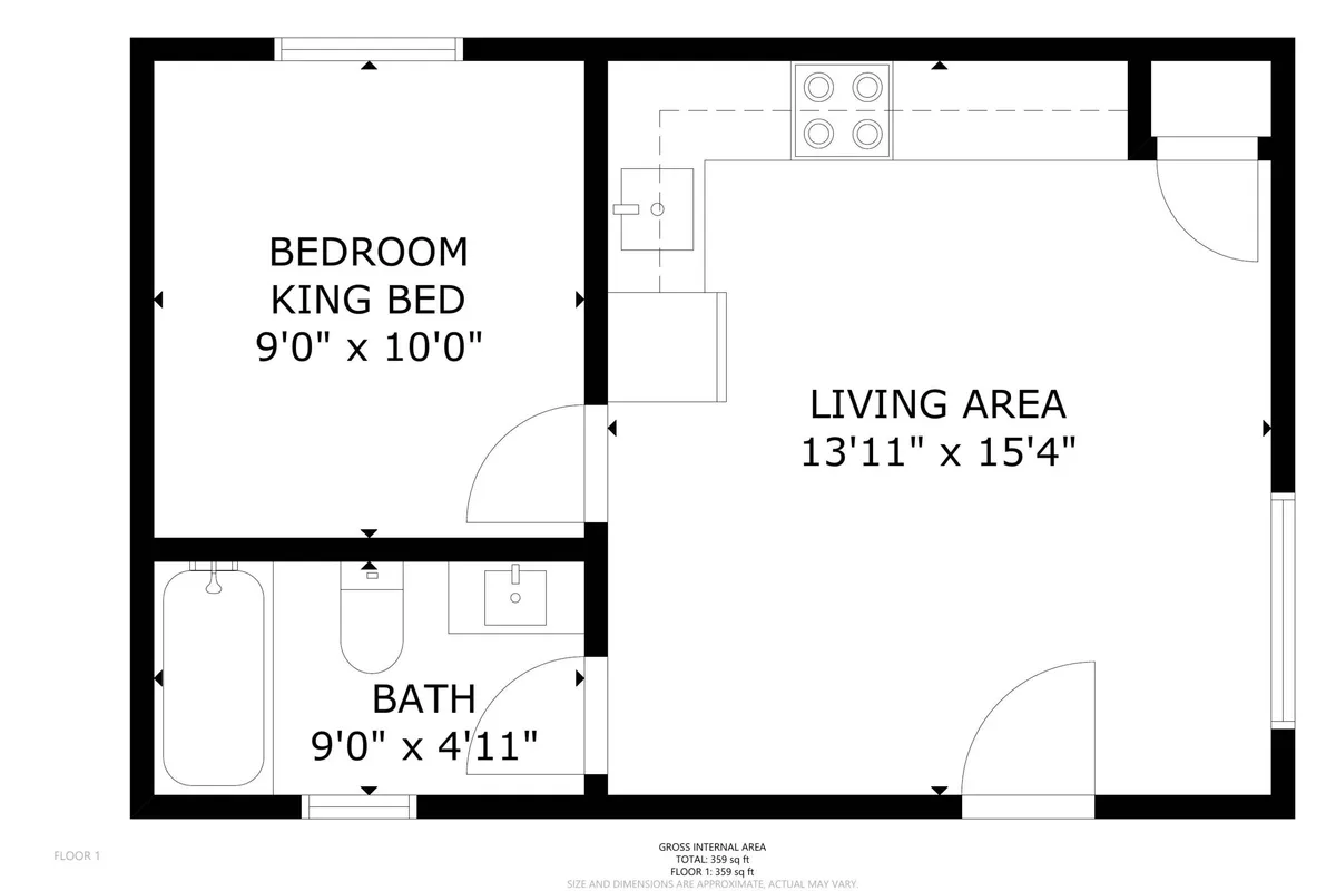 A spacious, comfortable bedroom with a king bed, adjacent living area, and a visible bathroom with a tub. The room exudes a cozy, welcoming atmosphere, ideal for restful nights and relaxed mornings.